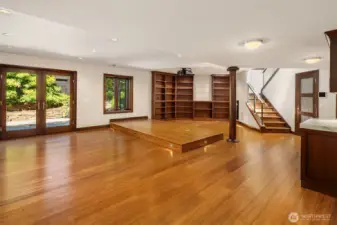 Lower level great room with built in library style shelving