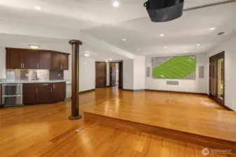 Lower level great room with built in movie theatre and raised seating