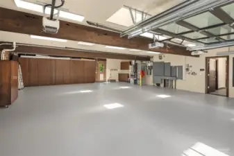 Garage has built in storage, pent wash station, and new epoxy floor