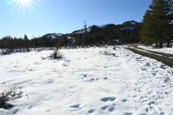 Looking towards Sun Mtn, with Green Meadows Dr. on the right, the water hook up area in front of the Mountain To River Realty sign.
