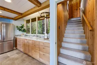 Garden sink with views out to the front of the house and the back staricase that leads up to the main bedroom.