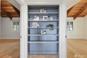 The bookshelf separates bedrooms 1 & 2 on main level