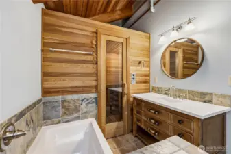 Main bathroom with soaking tub and sauna just behind the door.