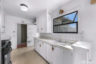 Kitchen sink with a window to the backyard