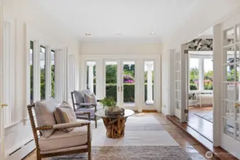 Sunroom off of the dining room and adjacent to the kitchen. This room captures the light from dawn until almost dusk. Begin your day with your cup of coffee and end with after dinner tea.