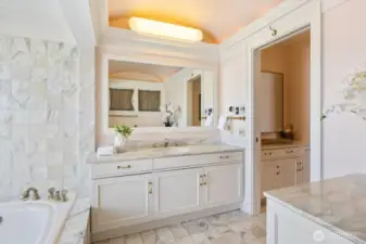 One of the TWO ensuite bathrooms in the primary bedroom. Soaking tub and walk-in shower. Separate vanity and of course a walk-in closet.
