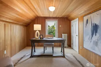 Third floor wood lined office or another bedroom. Two more spaces are up on this level. Another bedroom and a large closet or storage area. There is also a ktichenette if you have long term guests or need a spot to keep food and drinks for entertaining.