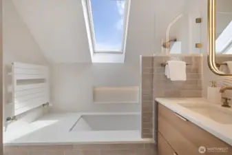One of the two top floor bathrooms. Remodeled with Brizo fixtures, specialty lighting, heated floors and custom floating vanity.