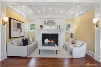 Oversized Statuario marble surround gas fireplace provides additional seating for entertaining or reading your favorite book.