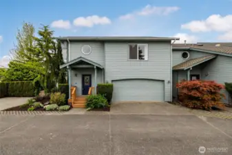 Two car garage plus extra outdoor parking.
