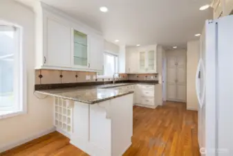 Upgraded kitchen with newer appliances, granite counter tops and beautiful cupboards.