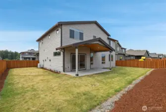 Covered patio with fully fenced corner lot.