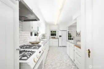 The updated kitchen opens to a family room that leads directly to the back patio and is part of the circular floor plan.
