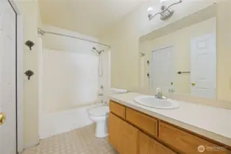 Bathroom with pocket door to Primary Bedroom