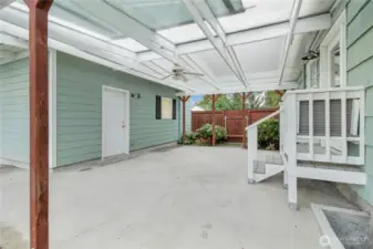 Rear covered patio is light and bright and has ceiling fan!
