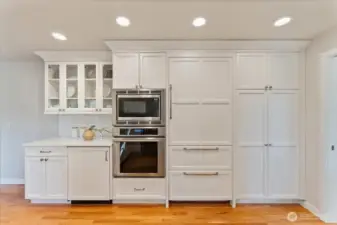 Sub-Zero paneled refrigerator with dual pull-out freezer drawers and a dedicated wine fridge create an ideal setup for entertainers.