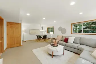 Enormous lower-level rec room offers multiple zones—space for a full sectional to enjoy TV and media, a separate table space for play or study, as well as generous storage space.