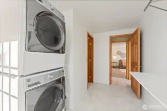 Generously sized utility room with newer washer and dryer.