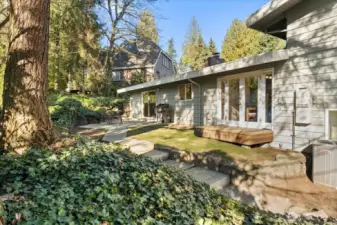 The yard is fully-fenced and low-maintenance landscaping, creating an ideal space for both pets and play.