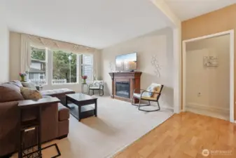 TALL ceilings and large windows bring in so much light with a sweet view out to the landscaping