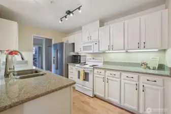 Light and Bright kitchen with solid surface countertops