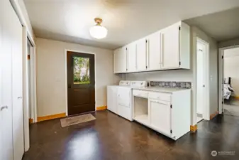 The downstairs utility room is very large with a lot of storage space.