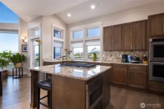 Door to the left of the kitchen provides access out to the deck.