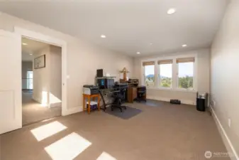 Large room over garage is currently used as an office, but could be converted to a bedroom if a closet is added. Could also be used for an exercise room.