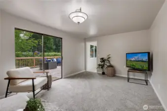 Nice size Family Room off of the kitchen/dining, leading to LARGE back deck or to Laundry/Garage.