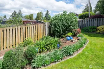 Mature landscaping and tons of flower plantings that bloom throughout the warmer months.