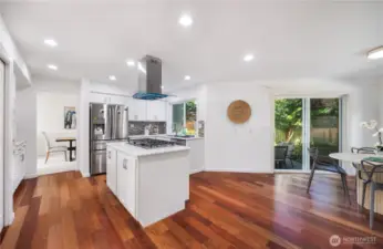 Open kitchen with new cooktop and new overhead range