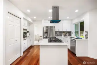 Open kitchen with new cooktop and new overhead range