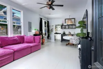 Large living and dining room with updated windows and an abundance of light