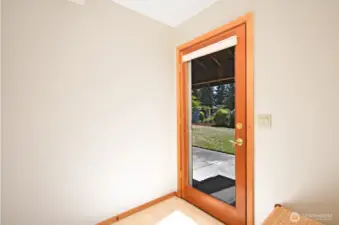 Mud room and door to the back yard and garage.
