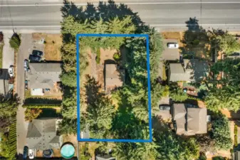 Birdseye view - 16,117 sq ft buildable lot opportunity - looking East to West at lot - property abuts 148th on the North boundary with two dozen Ponderosa Pines bordering the property.