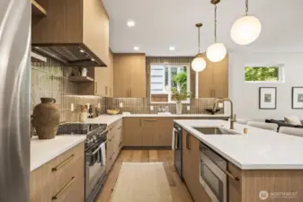 Well designed kitchen is spacious and functional with beautiful finishes.