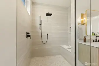 Convenient bench and handled shower feature