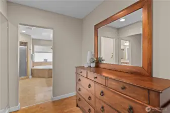 A convenient dressing room space just off the primary closet.