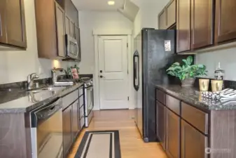 The kitchen is spacious with granite counters.