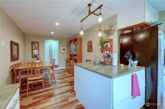 Kitchen Peninsula  to the right this picture shows the beautiful Brazilian Pecan Hardwood Floors