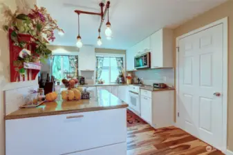The Remodeled Kitchen cabinets are quality wood cabinets and the counters are solid surface. You have full extension deep drawers with amazing amount of storage.
