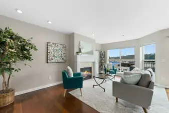 Living room with hardwood floors and gas fireplace.