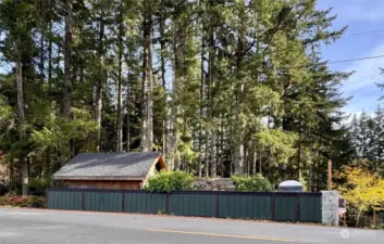 This .44 acre lot with 75 feet of lakefront canal access has had many improvements and outbuildings added. Custom fencing made with the lumber harvested from the property.