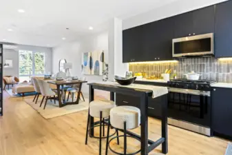 This open-concept layout keeps everyone connected — from kitchen prep to dinner to movie nights in the living room.