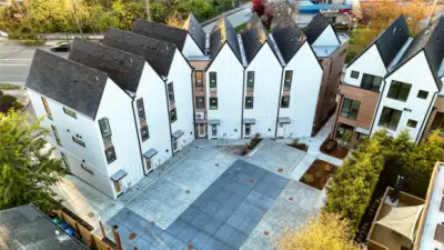 An exclusive community courtyard designed for connection, safety, and ease — with clean concrete paths and no through traffic.