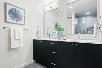 Dual vanities, modern lighting, and room to spread out — this primary bath brings spa energy home.