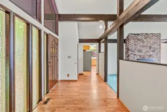 Large entry area opens to beams, vaults & views!