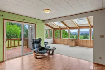From dining to sunroom/atrium! Look at the views!! And what about those skylights!!