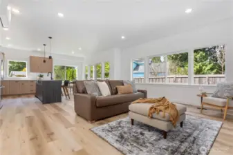 Great room showing sitting, and eating areas and access to patio and rear yard.
