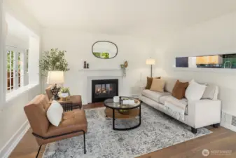 Formal living room off the front entry with cozy fireplace